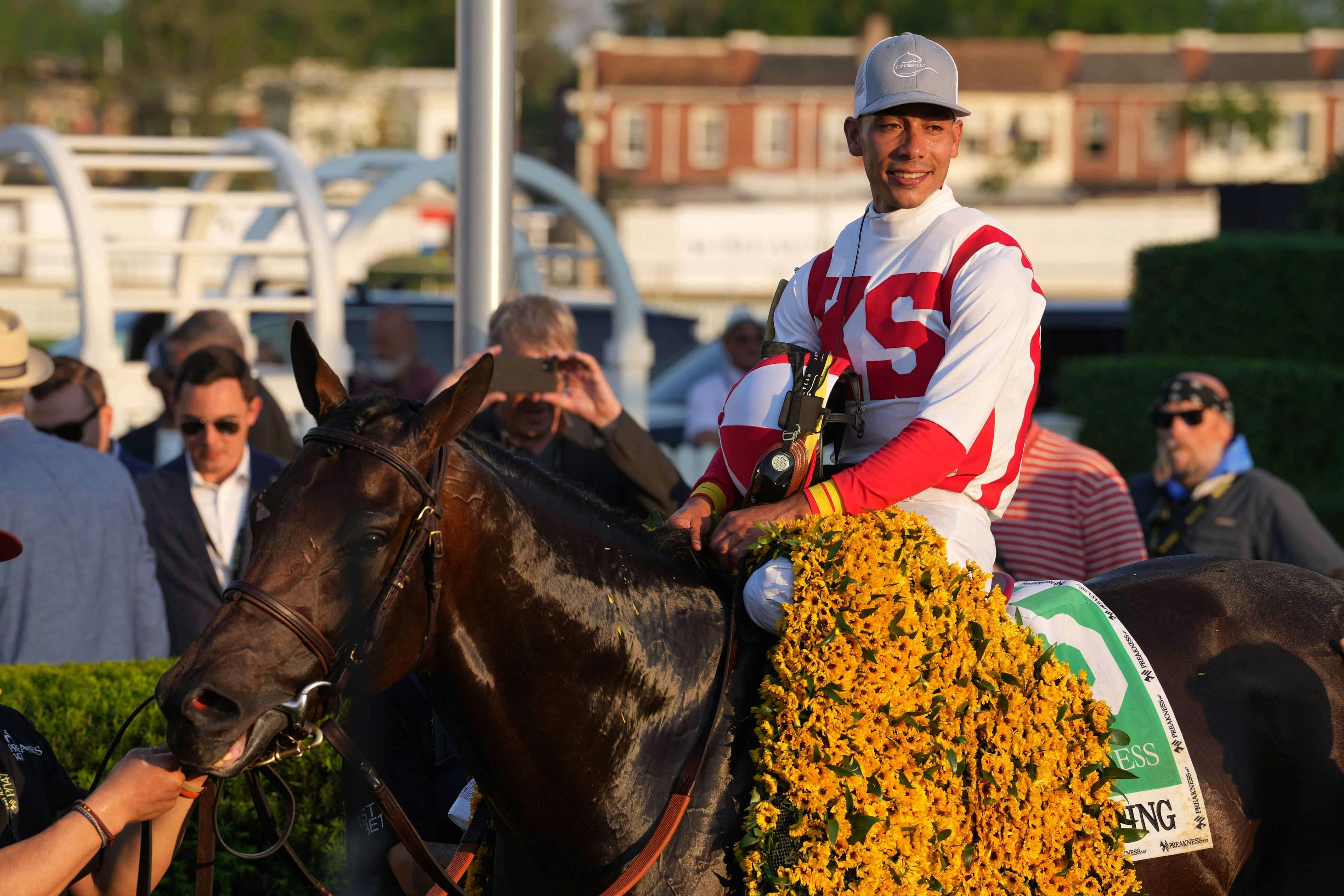 Early Voting jockey Jose Ortiz aboard in the winners circle after the Preakness Stakes at Pimlico Race Course. Mandatory Credit: Mitch Stringer-USA TODAY Sports