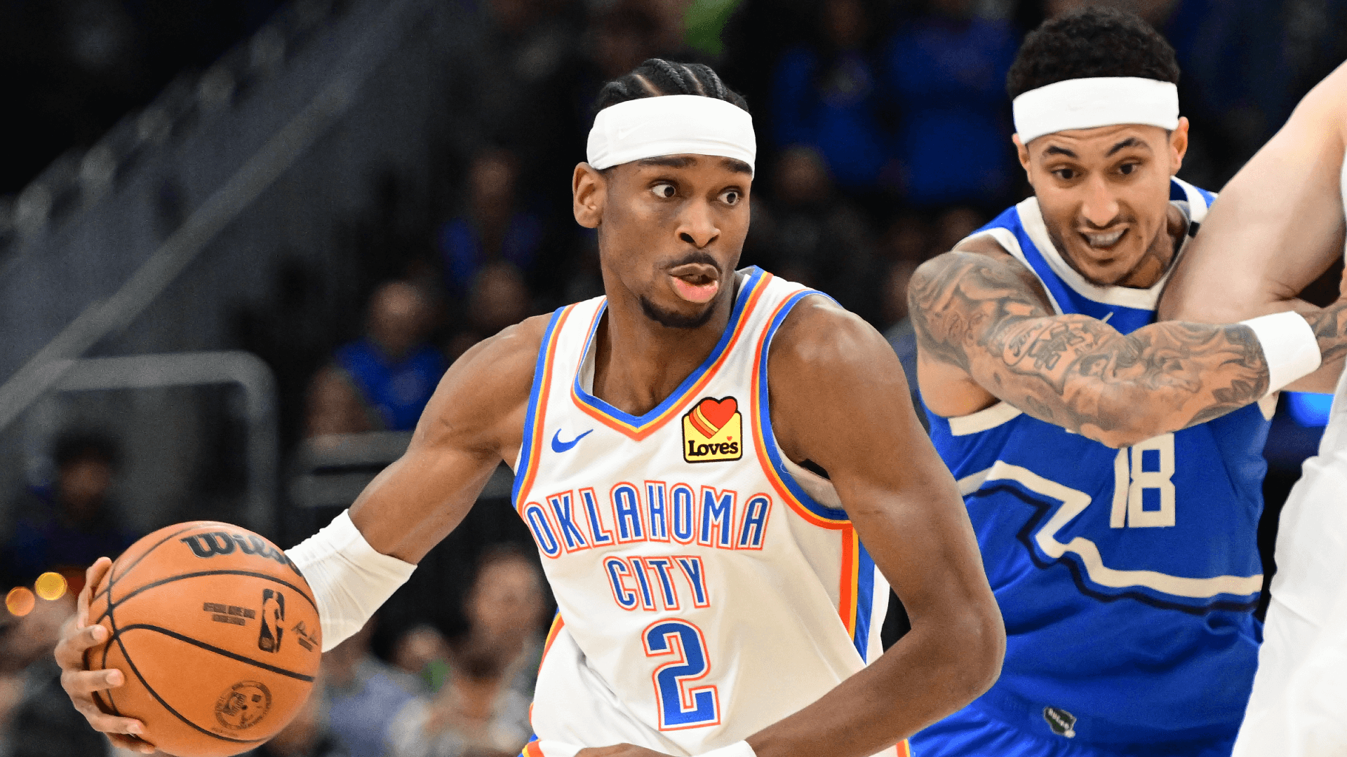 Oklahoma City Thunder guard Shai Gilgeous-Alexander (2) drives for the basket against Milwaukee Bucks forward Kyle Kuzma (18).