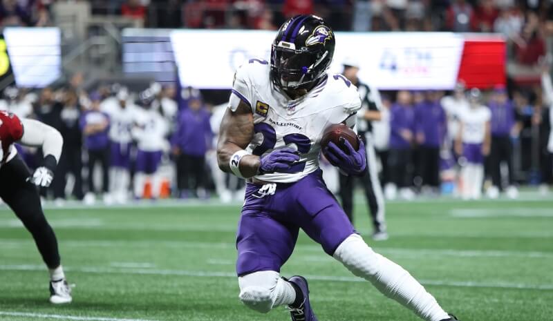Baltimore Ravens running back Derrick Henry (22) runs during the fourth quarter.