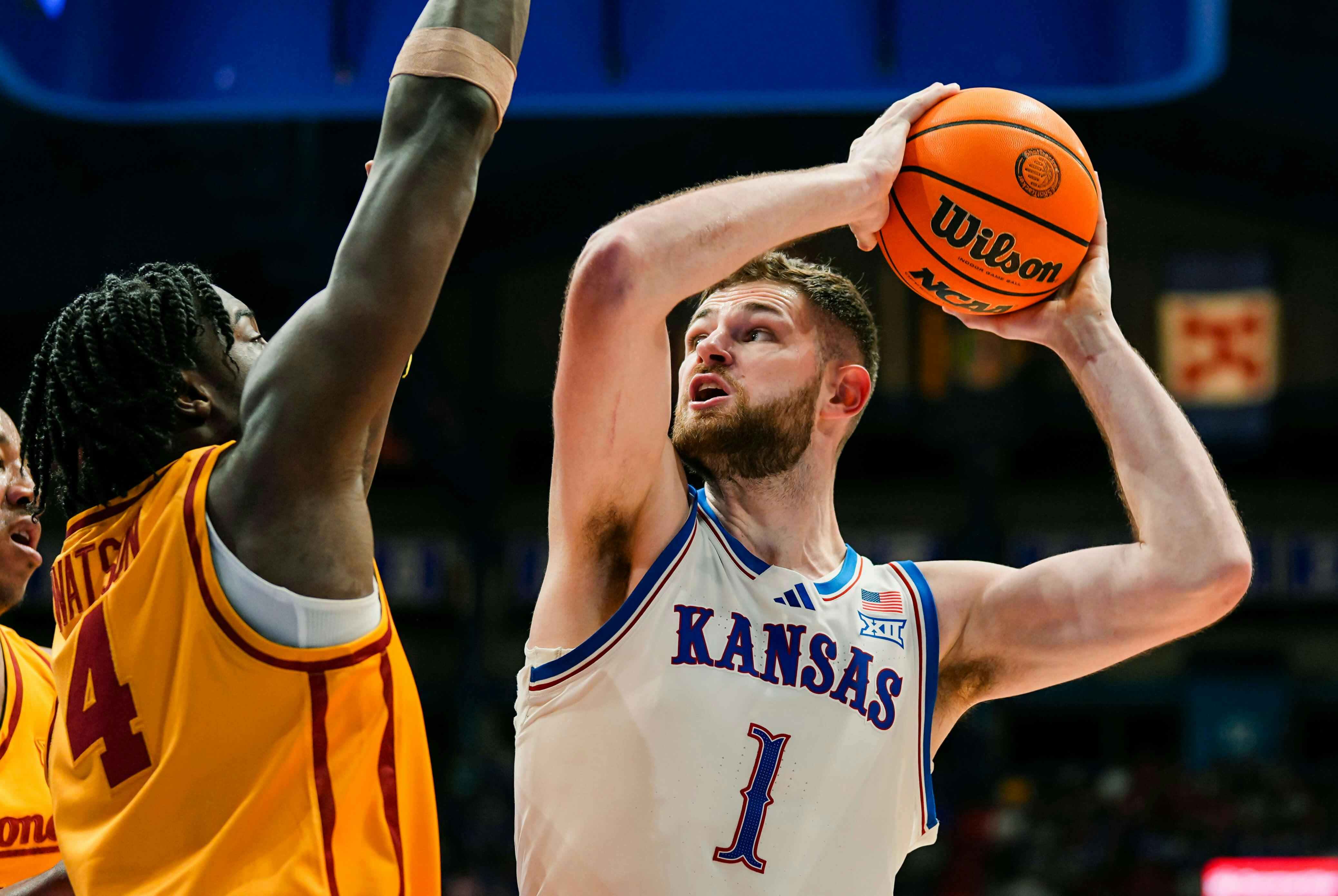 Kansas Jayhawks center Hunter Dickinson (1) shoots against Iowa State Cyclones guard Demarion Watson (4) during the second half at Allen Fieldhouse. Mandatory Credit: Jay Biggerstaff-Imagn Images