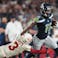 Arizona Cardinals safety Budda Baker (3) dives after Seattle Seahawks receiver Jaxon Smith-Njigba (11).