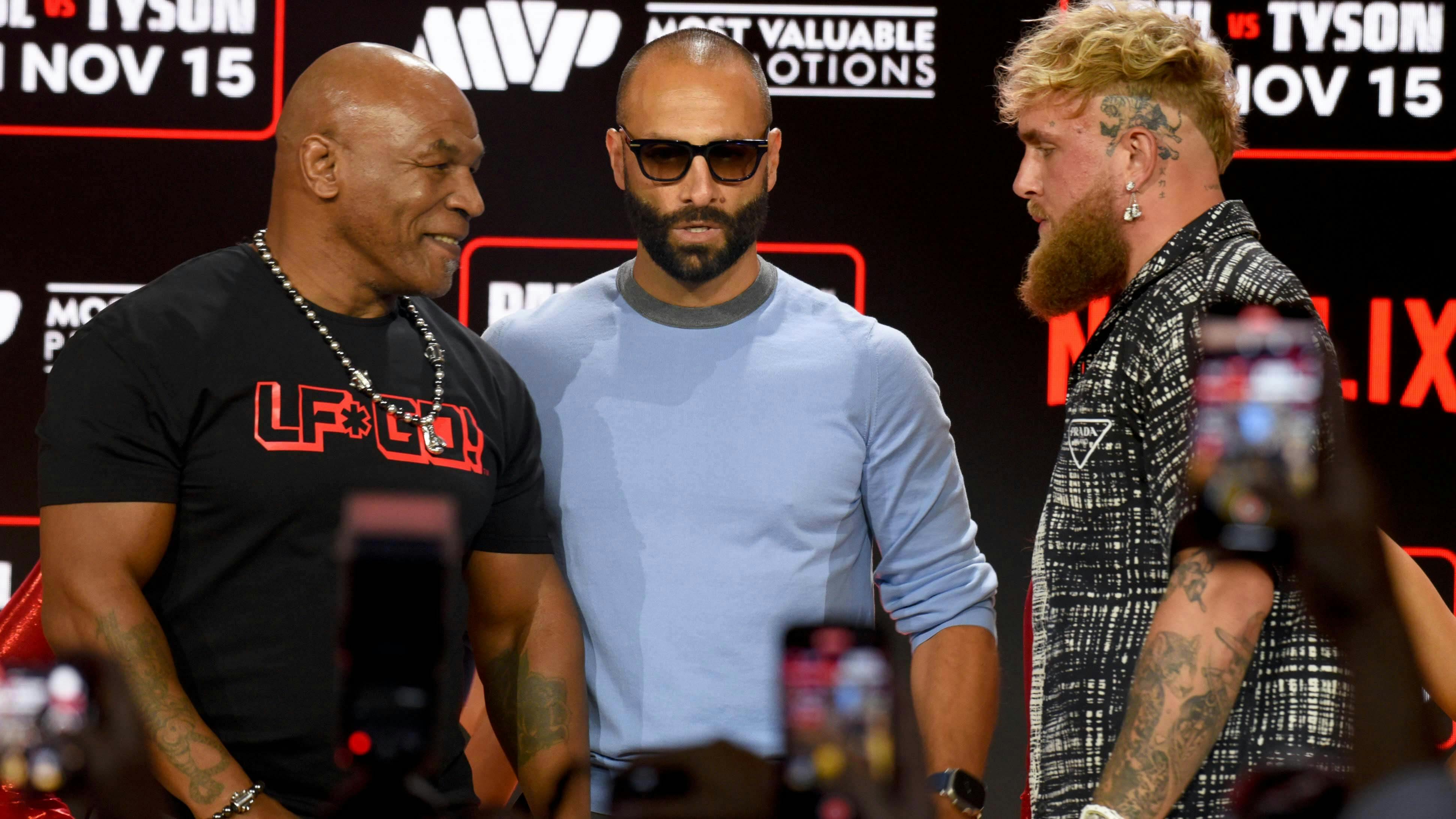 Mike Tyson and Jake Paul face off at boxing fight press conference at Fanatics Fest.