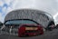A general overall view as a red double decker bus passes by Tottenham Hotspur Stadium. Kirby Lee-Imagn Images