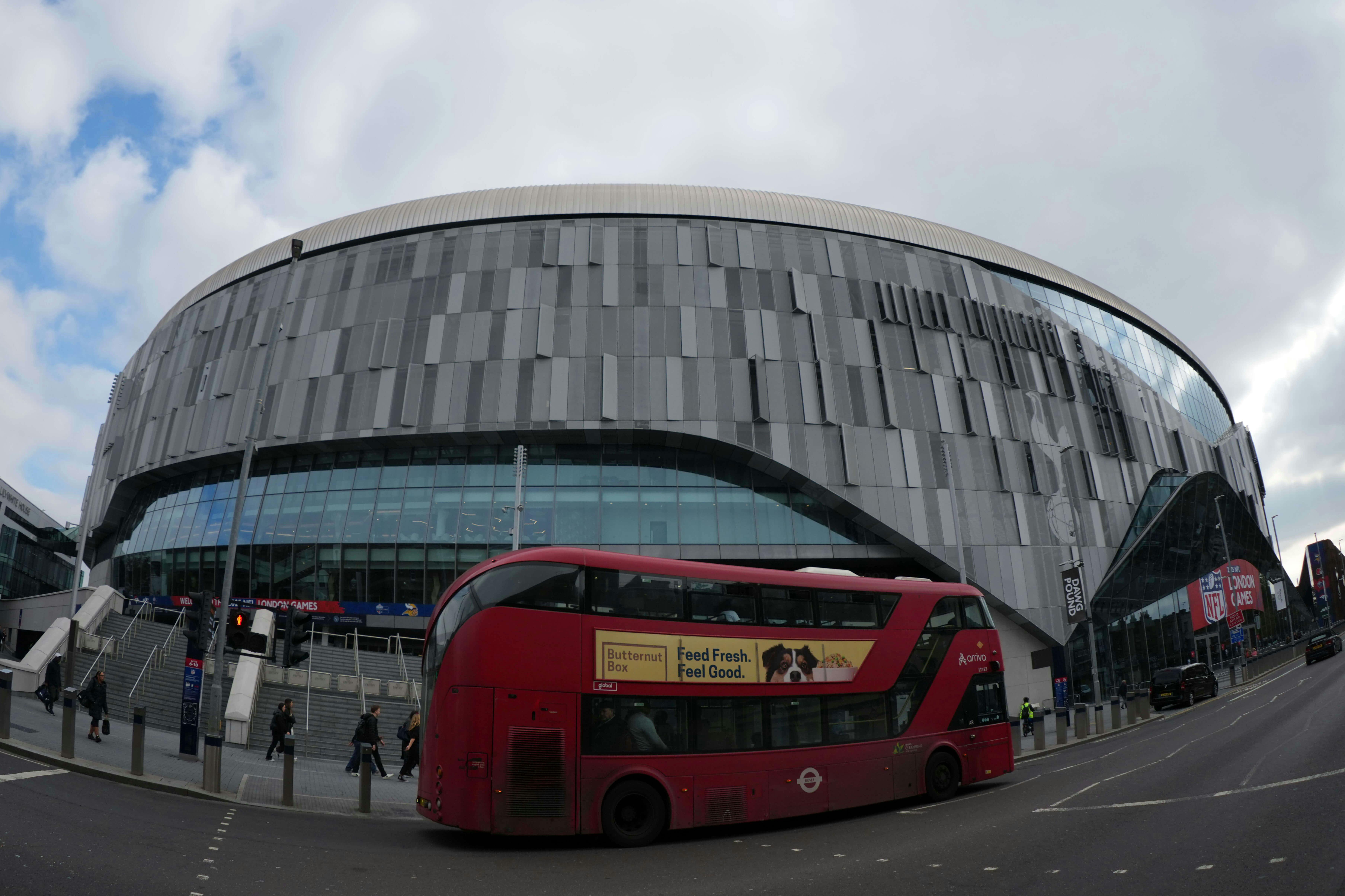 A general overall view as a red double decker bus passes by Tottenham Hotspur Stadium. Kirby Lee-Imagn Images