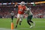 Miami Hurricanes quarterback Carson Beck (11) carries the football for a touchdown against South Florida.