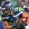 Seattle Seahawks running back Zach Charbonnet (26) runs for a touchdown during the third quarter against the Houston Texans at Lumen Field.