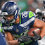 Seattle Seahawks running back Zach Charbonnet (26) runs for a touchdown during the third quarter against the Houston Texans at Lumen Field.
