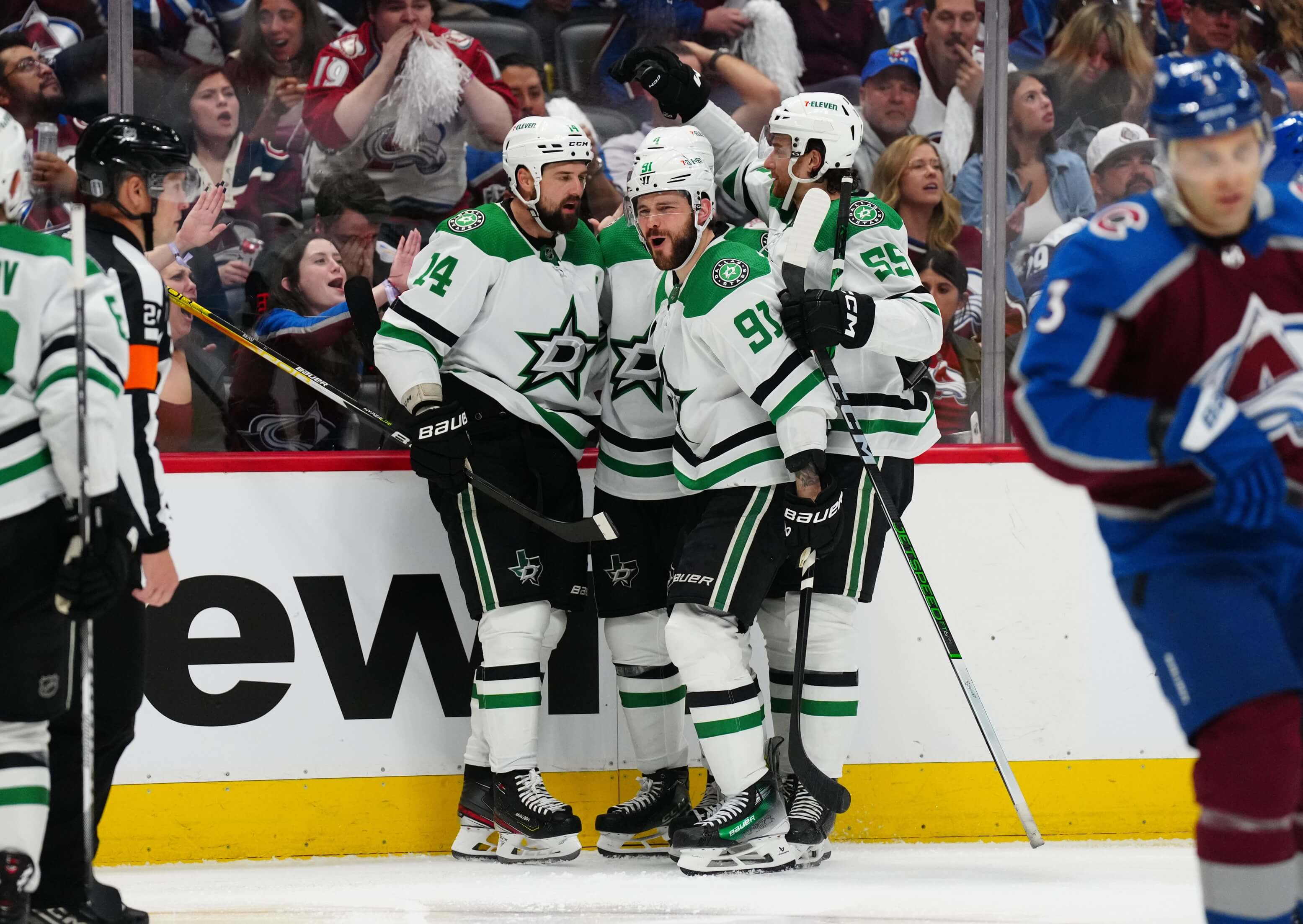 Dallas Stars left wing Jamie Benn (14) celebrates his goal scored with center Tyler Seguin (91) and defenseman Thomas Harley (55) and defenseman Miro Heiskanen (4) in the third period against the Colorado Avalanche in game six.