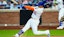 New York Mets outfielder Juan Soto (22) connects with a ball.