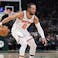 New York Knicks guard Jalen Brunson (11) brings the ball up the court against the Milwaukee Bucks in the second half at Fiserv Forum.