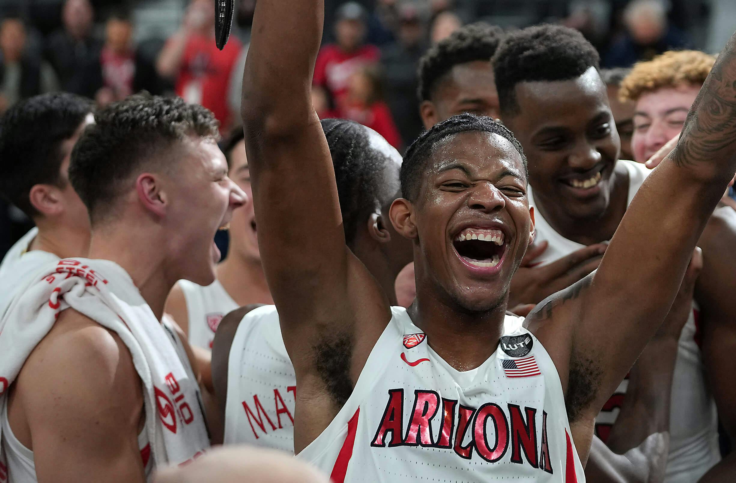 Arizona Wildcats guard Dalen Terry (4) celebrates with his team mates after defeating the Michigan Wolverines 80-62 to win the Roman Main Event Championship game at T-Mobile Arena.