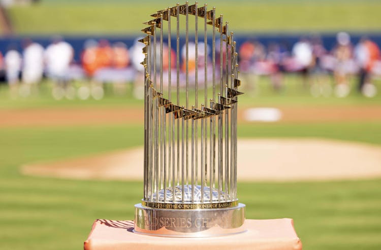 The World Series trophy sits atop home plate prior to the game between the New York Mets and the Houston Astros at The Ballpark of the Palm Beaches. Mandatory Credit: Reinhold Matay-USA TODAY Sports