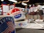 People prepare to cast their ballots while voting in the Michigan Primary elections at the Royal Oak Farmers Market in Royal Oak on Tuesday, Aug. 6, 2024.