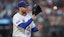  New York Mets starting pitcher David Peterson (23) catches the ball.