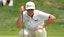 J.T. Poston lines up a putt on the 16th green during the first round of the BMW Championship