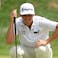 J.T. Poston lines up a putt on the 16th green during the first round of the BMW Championship