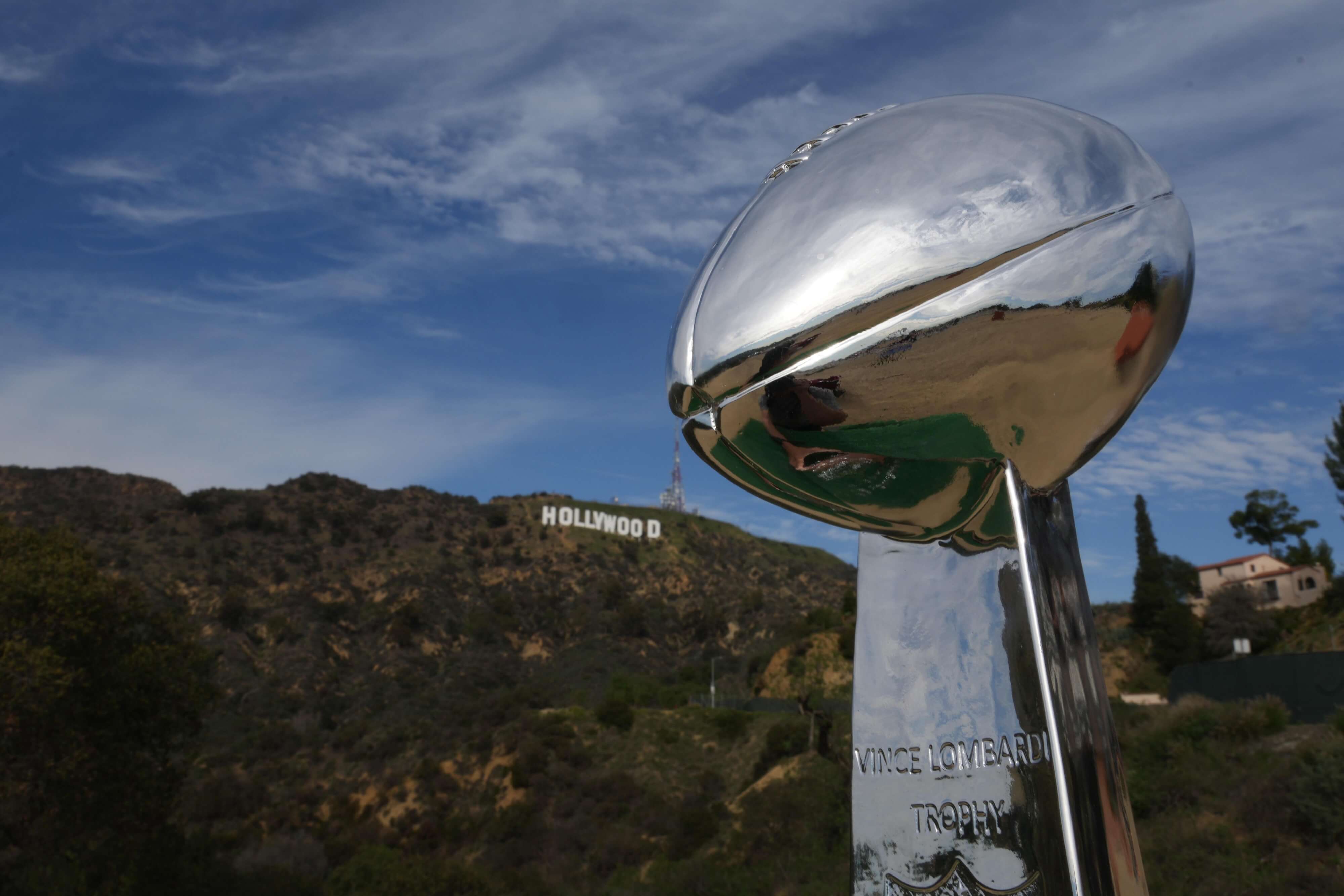 A Vince Lombardi trophy is seen at the Hollywood sign. The Cincinnati Bengals will play the Los Angeles Rams at SoFi Stadium on Feb. 13, 2022.