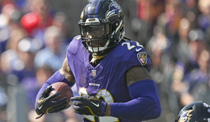 Baltimore Ravens running back Derrick Henry carries the ball.