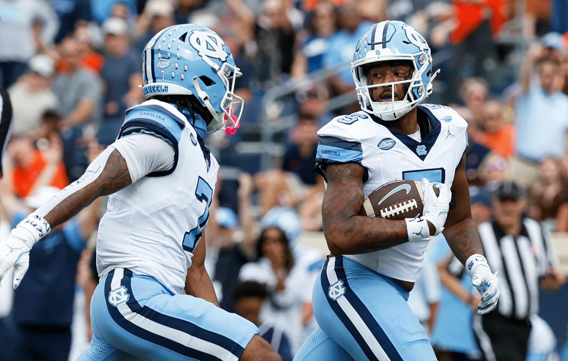 North Carolina Tar Heels wide receiver J.J. Jones (5) scores a touchdown as Tar Heels wide receiver Christian Hamilton (7) celebrates against the Virginia Cavaliers during the first half at Scott Stadium. Mandatory Credit: Geoff Burke-Imagn Images