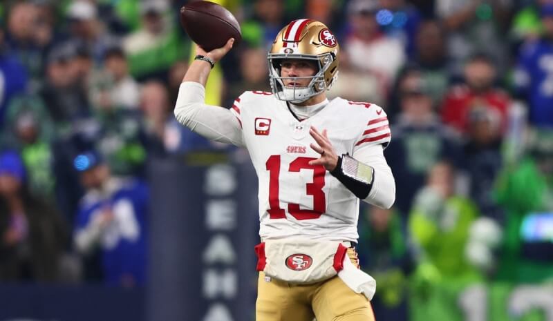 San Francisco 49ers quarterback Brock Purdy (13) throws downfield.