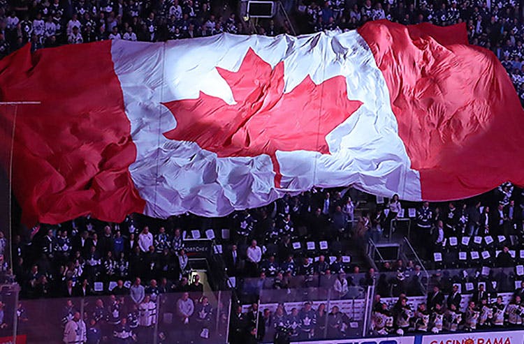 Canadian flag unfurled at a sporting event