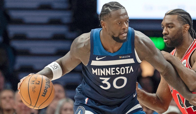 Julius Randle (30) dribbles the ball as Chicago Bulls forward Patrick Williams (44) defends in the second half at Target Center.