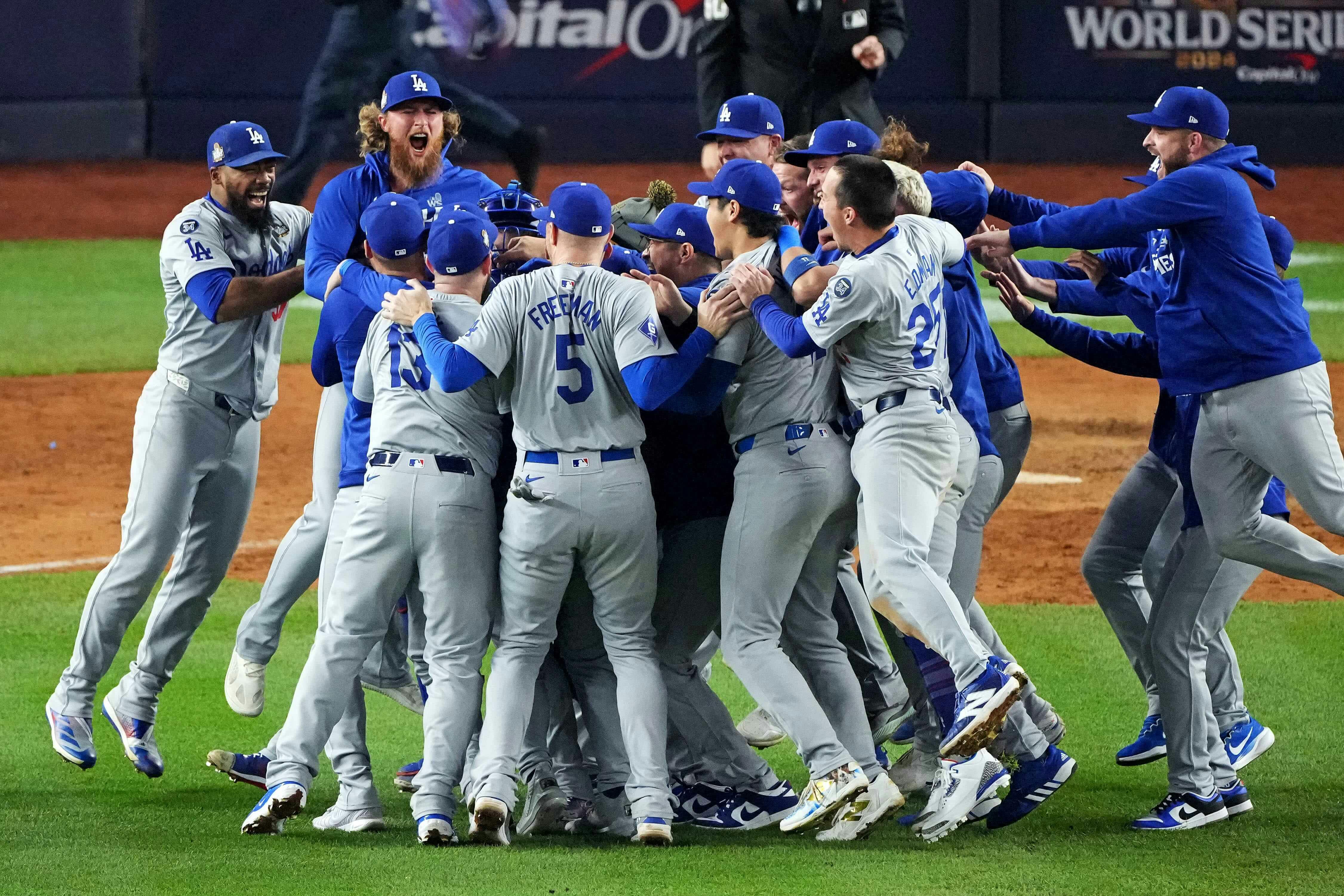 The Los Angeles Dodgers celebrate after beating the New York Yankees in Game 5 to win the World Series at Yankee Stadium.