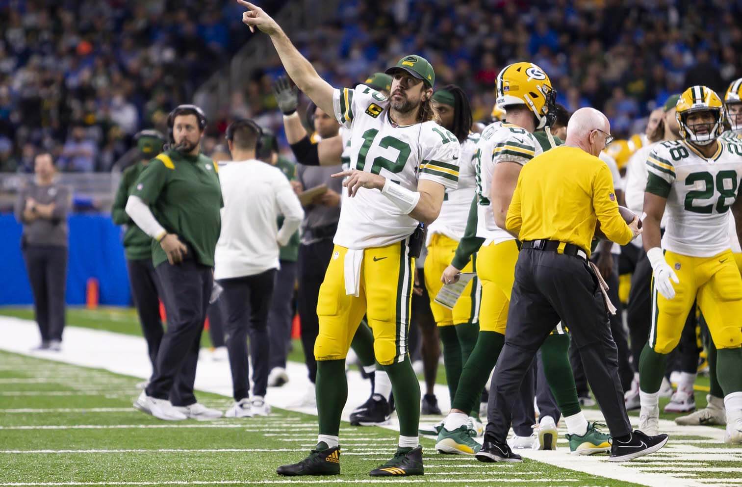 Green Bay Packers quarterback Aaron Rodgers (12) points to the other side of the field during the fourth quarter against the Detroit Lions at Ford Field.