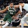 Milwaukee Bucks forward Giannis Antetokounmpo (34) drives for the basket against San Antonio Spurs forward Victor Wembanyama (1).