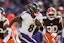 Baltimore Ravens quarterback Lamar Jackson (8) runs the ball against the Cleveland Brownsduring the second quarter at Huntington Bank Field. Mandatory Credit: Scott Galvin-Imagn Images