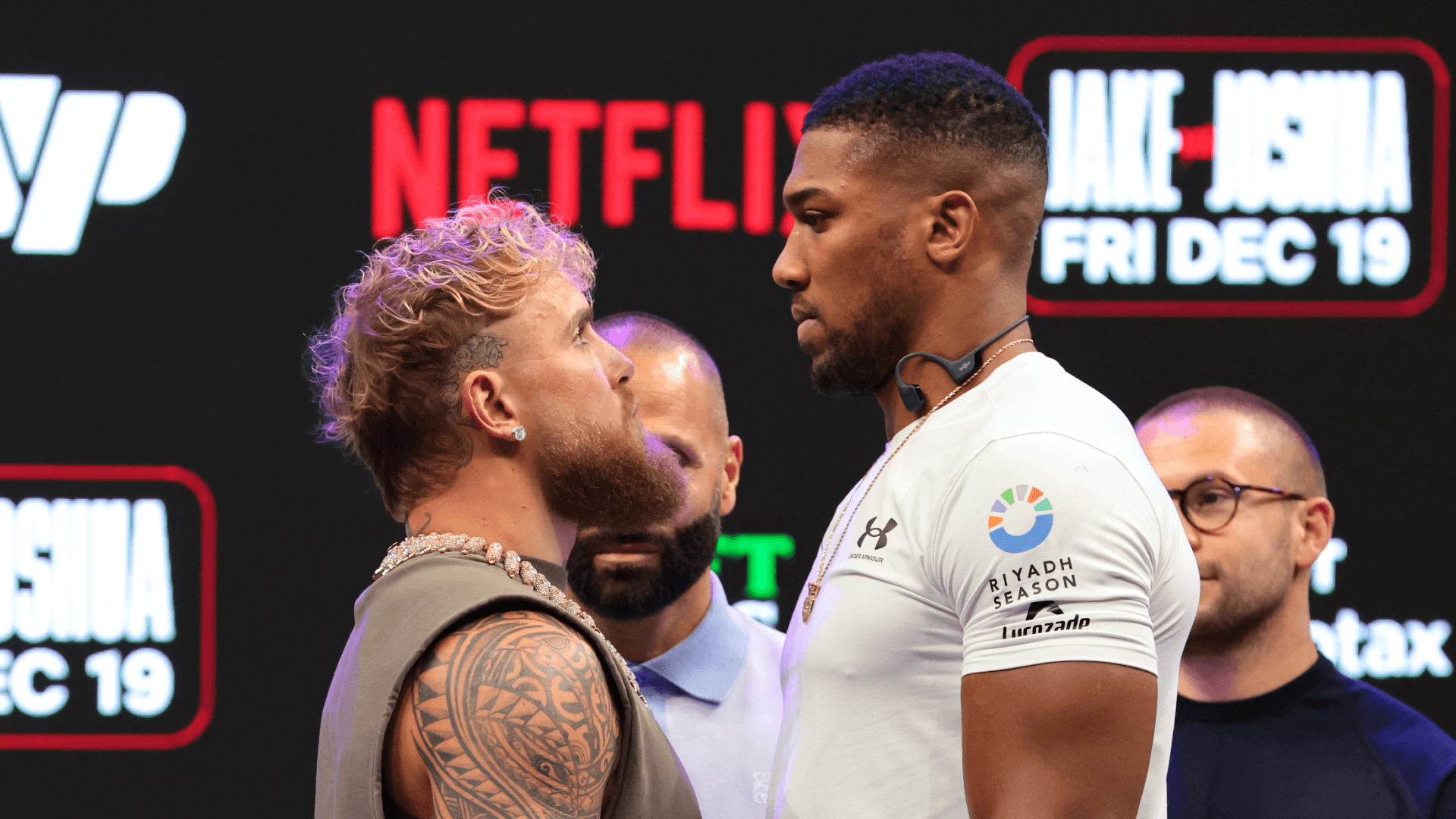 Jake Paul and Anthony Joshua face off after a press conference announcing their heavyweight boxing match at Kayesa Center.
