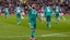 Liverpool's Mohamed Salah (C) celebrates after scoring a penalty goal.