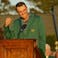 Scottie Scheffler talks to the crowd while wearing his green jacket during the final round of the Masters Tournament at Augusta National Golf Club.