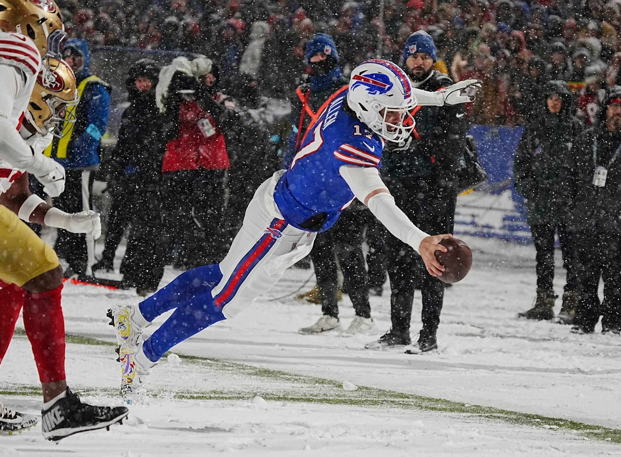 Bills Josh Allen leaps to the end zone in a nine-yard touchdown run.