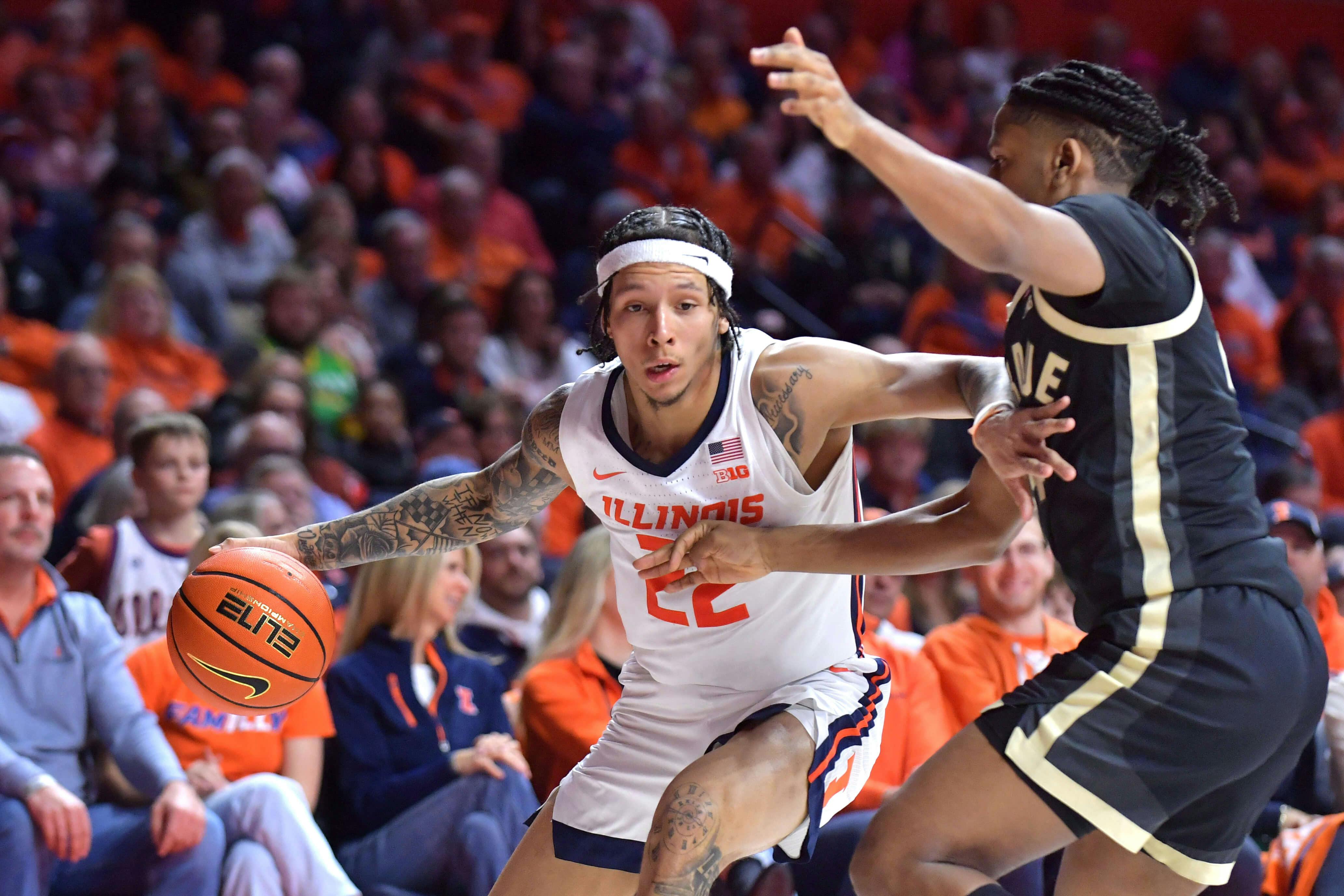 Illinois Fighting Illini guard Tre White (22) drives the ball against Purdue Boilermakers guard C.J. Cox (0) during the first half at State Farm Center