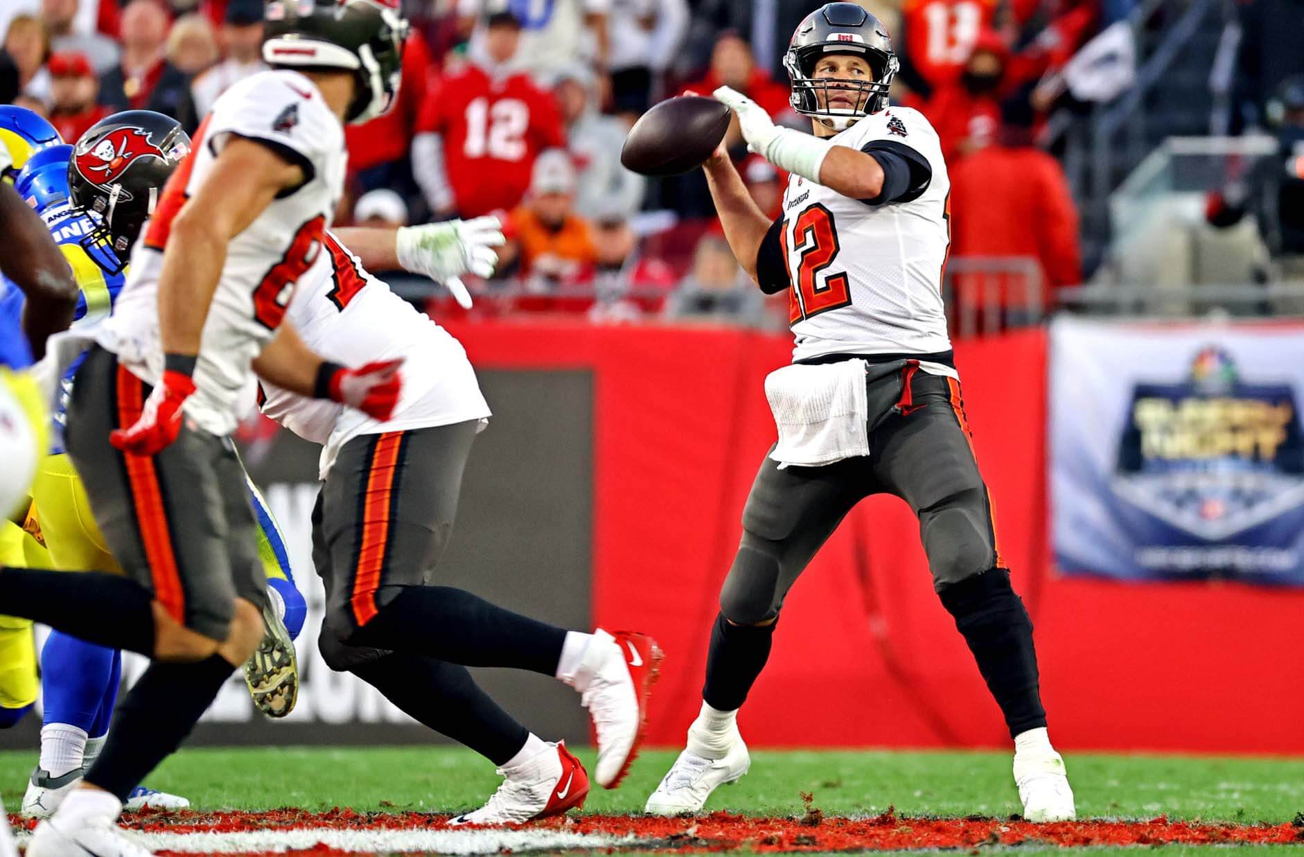 Tampa Bay Buccaneers quarterback Tom Brady (12) throws a pass during the second half against the Los Angeles Rams in a NFC Divisional playoff football game at Raymond James Stadium.