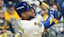 Milwaukee Brewers right fielder Jackson Chourio (11) hits a solo home run against the Los Angeles Dodgers. 