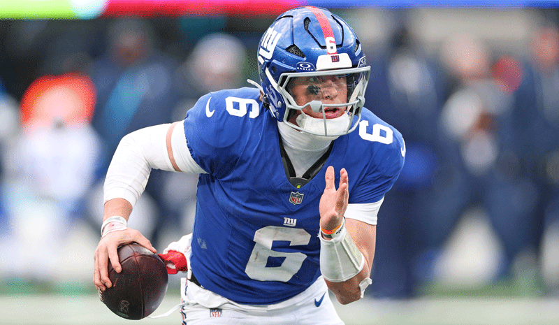 Jaxson Dart (6) scrambles during the fourth quarter against the Dallas Cowboys.