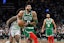 Boston Celtics forward Jayson Tatum (0) lines up for a dunk against the Philadelphia 76ers.