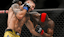 Marc Diakiese (red gloves) fights Joel Alvarez (blue gloves) during UFC Fight Night at O2 Arena.