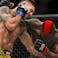 Marc Diakiese (red gloves) fights Joel Alvarez (blue gloves) during UFC Fight Night at O2 Arena.