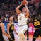 Denver Nuggets center Nikola Jokic (15) shoots the ball in front of Golden State Warriors forward Draymond Green (23) in the first quarter during game five of the first round for the 2022 NBA playoffs at Chase Center.