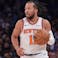 New York Knicks guard Jalen Brunson (11) dribbles up court during the second half against the Charlotte Hornets at Madison Square Garden.