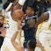 Memphis Grizzlies guard Ja Morant (12) drives to the basket against the Golden State Warriors during the first quarter at Chase Center.