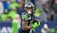 Seattle Seahawks wide receiver Jaxon Smith-Njigba (11) runs with the ball.