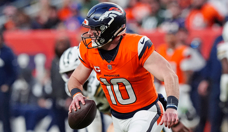 Denver Broncos quarterback Bo Nix (10) runs in the pocket during the third quarter against the Green Bay Packers at Empower Field at Mile High.