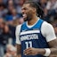 Minnesota Timberwolves center Naz Reid (11) laughs with a teammate.