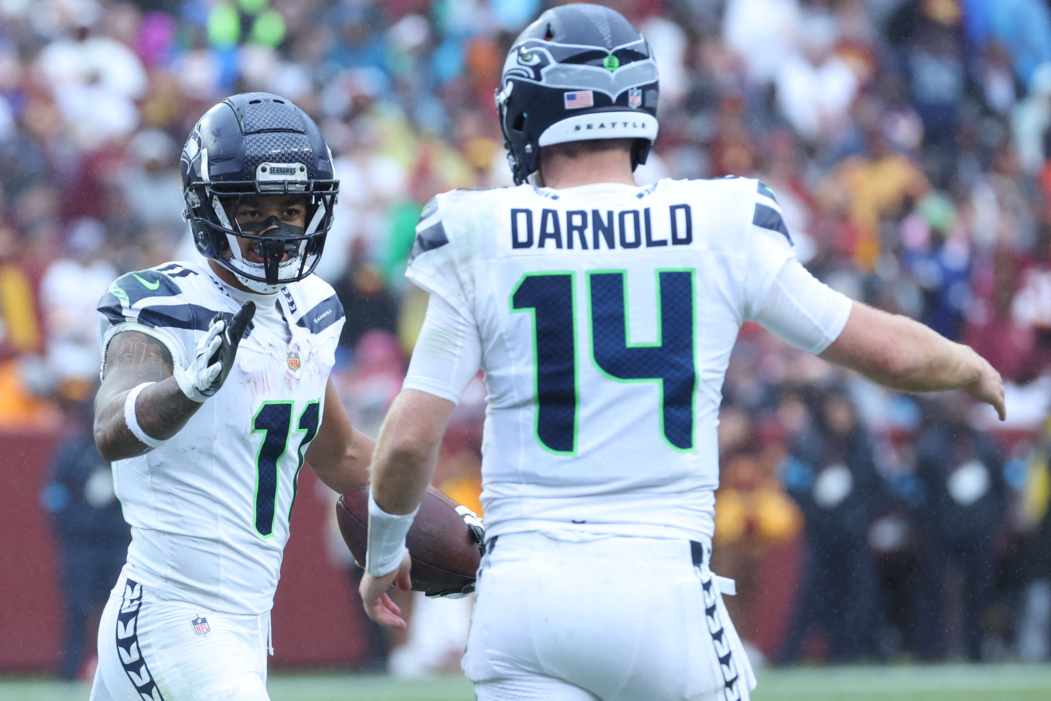 Seahawks vs Broncos AI predictions TNF, Seattle Seahawks wide receiver Jaxon Smith-Njigba (11) reacts after a catch with quarterback Sam Darnold (14).