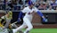 New York Mets right fielder Juan Soto (22) follows through on an RBI single.