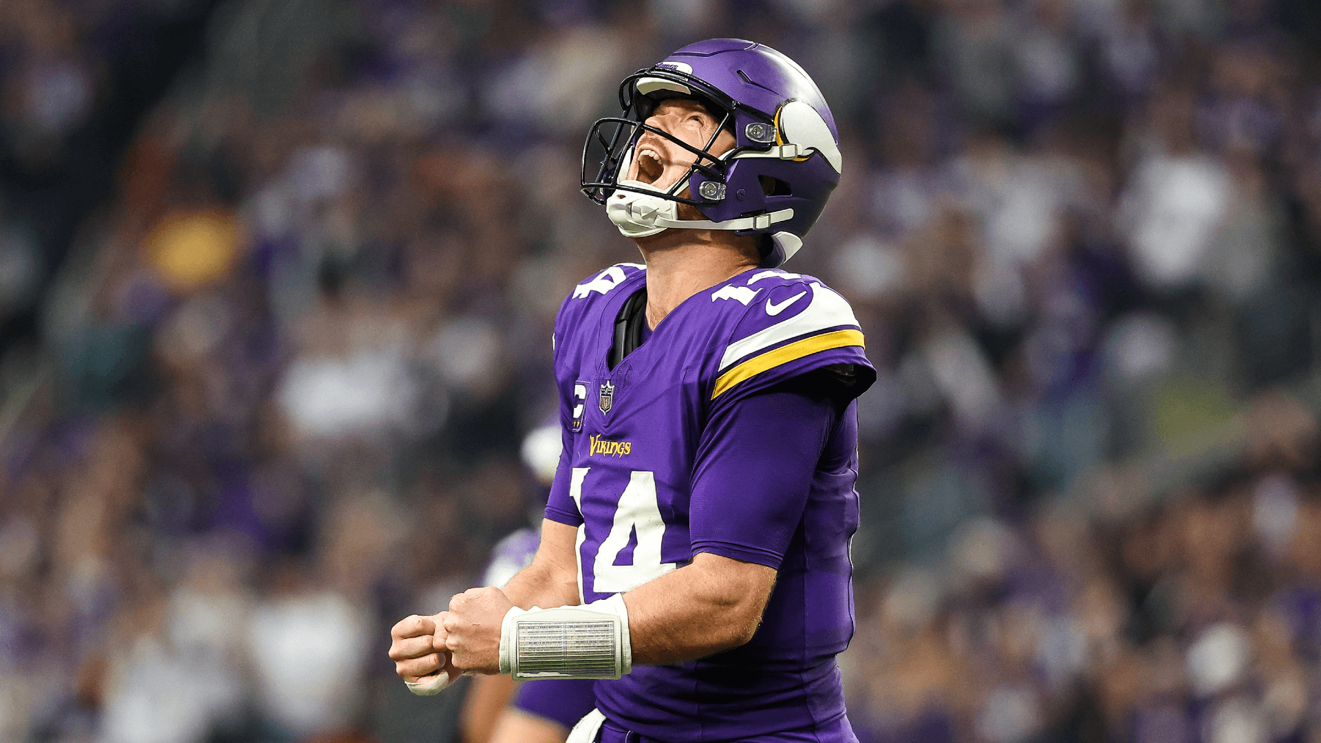 Minnesota Vikings quarterback Sam Darnold (14) celebrates his touchdown to wide receiver Jordan Addison (3).